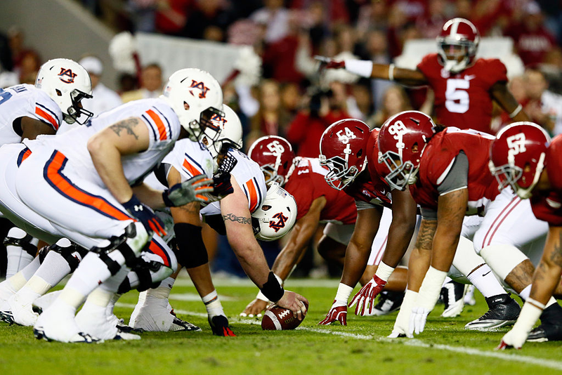 The Auburn Tigers line up against the Alabama Crimson Tide during the 2014 Iron Bowl in Tuscaloosa, Ala. Kevin C. Cox/Getty Images